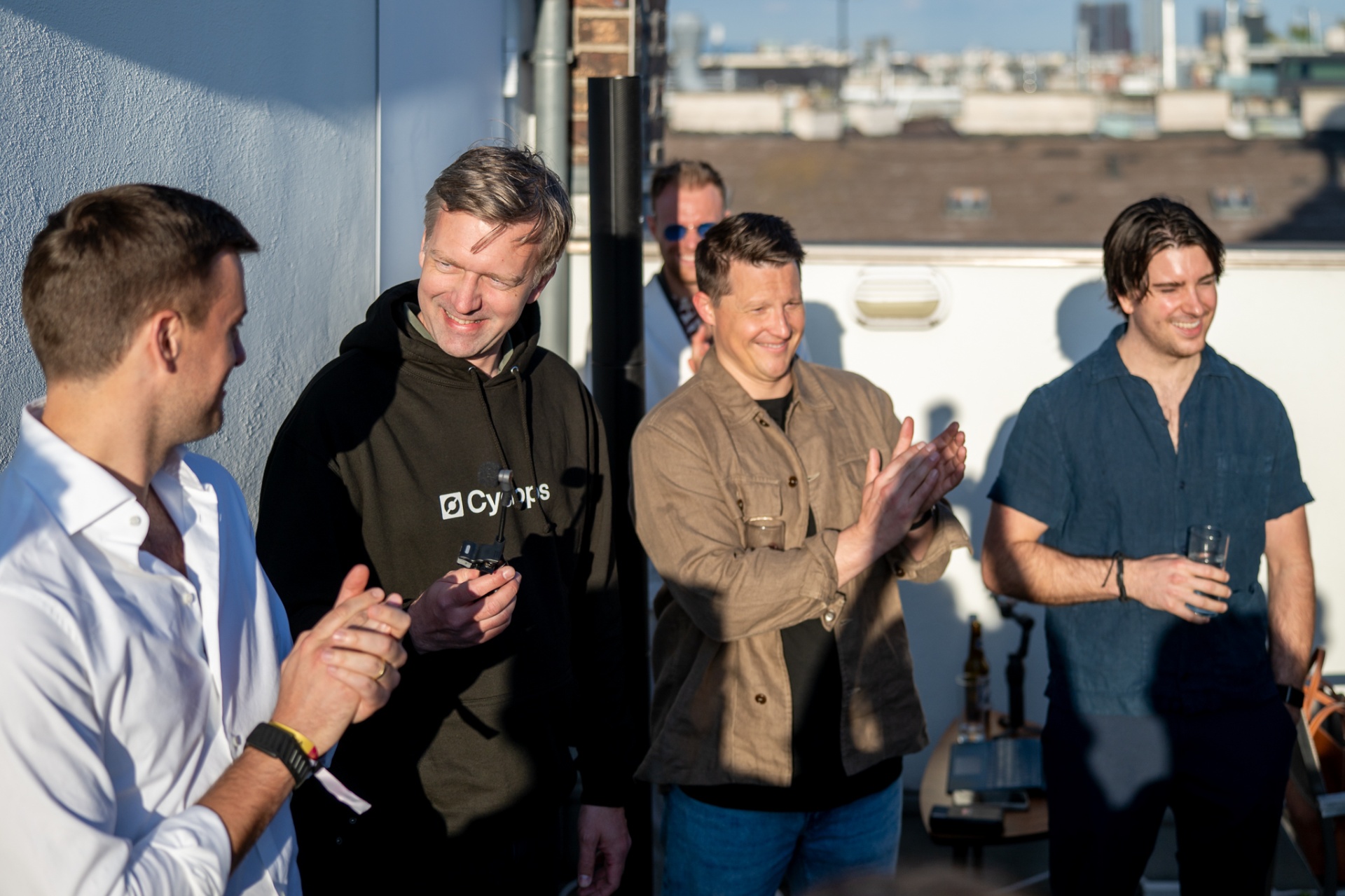 Cyclops team applauding at the office opening
