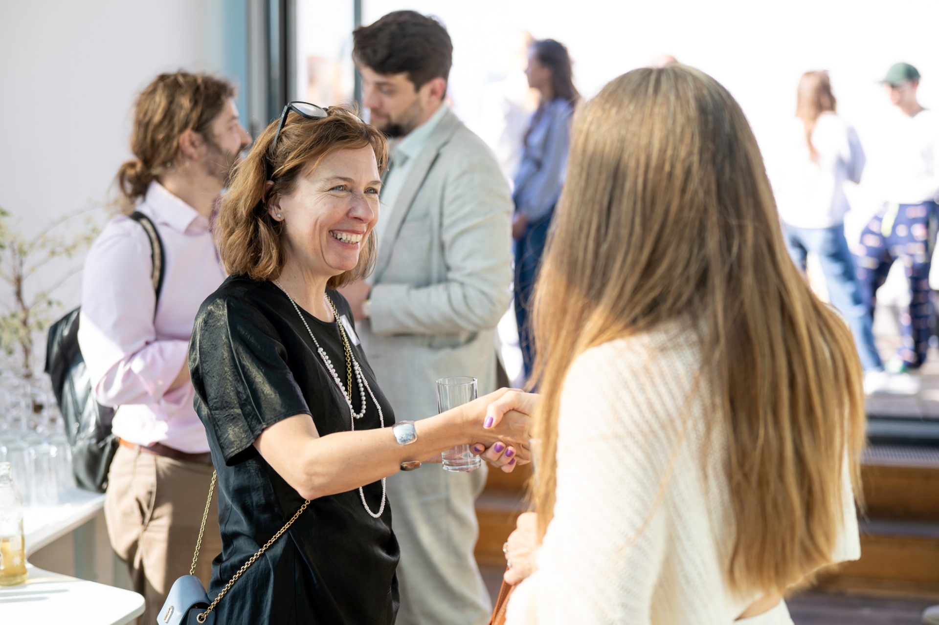 Colleagues greeting each other at the Cyclops office opening